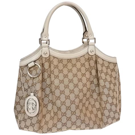 gucci white embossed pouch|Gucci monogram shoulder bag.